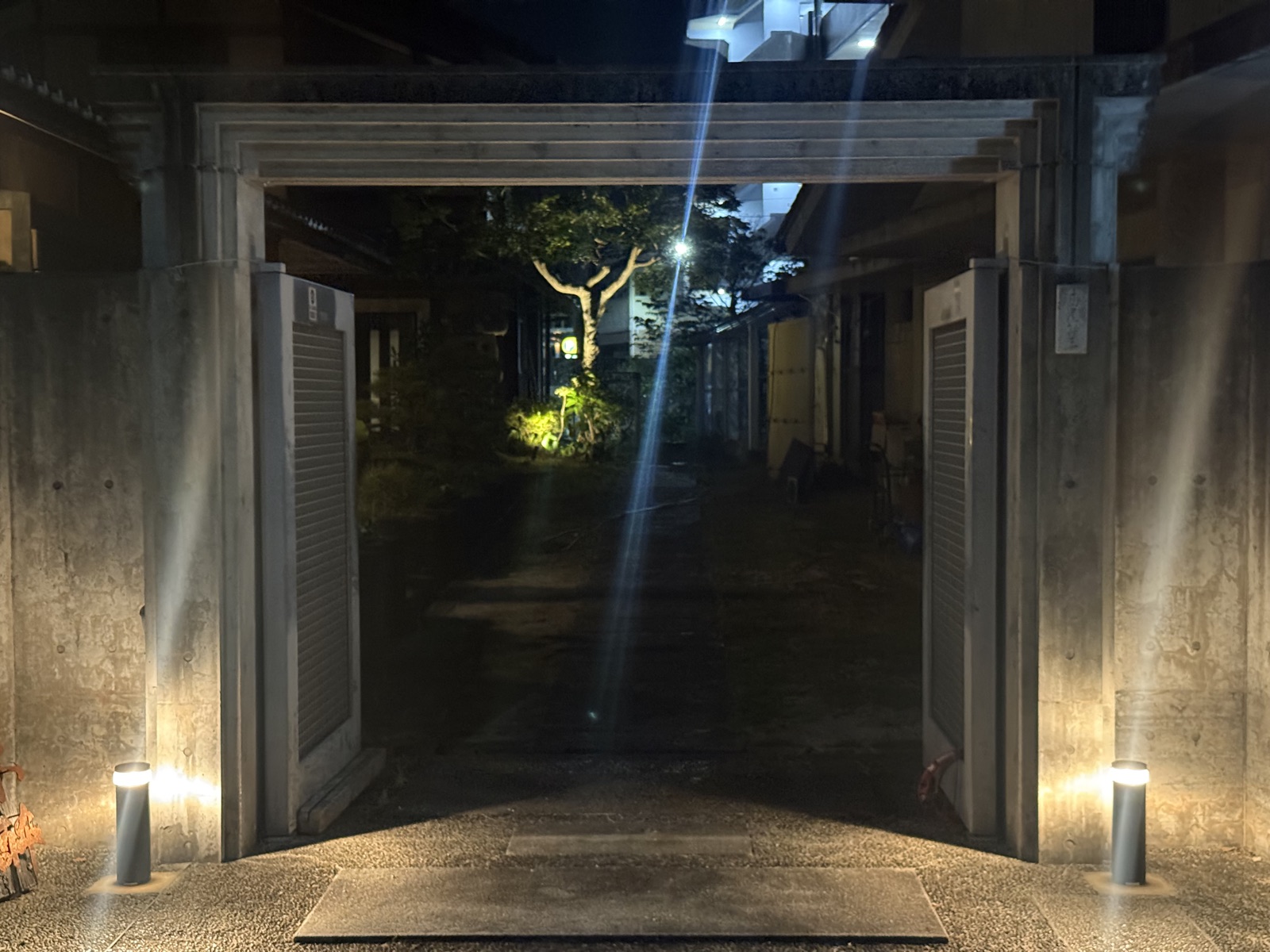 Historic Japanese building illuminated at night in Hiroshima alley