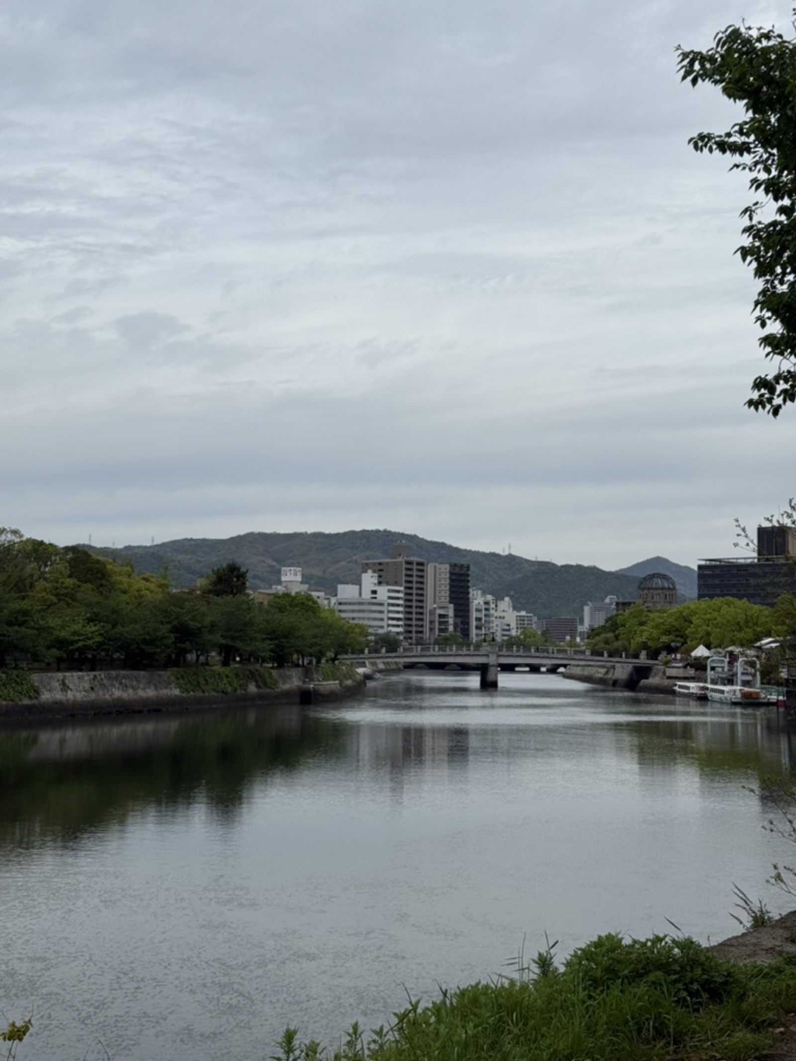 Overcast sky over central Hiroshima with the A-Bomb Dome and Motoyasu Bridge across the river