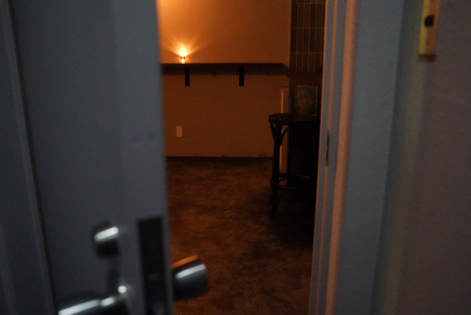 Looking into VUELTA's dim room from the doorway